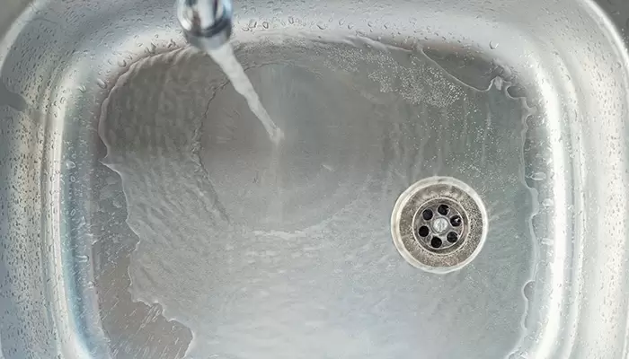 Water Going Down Clear Drain